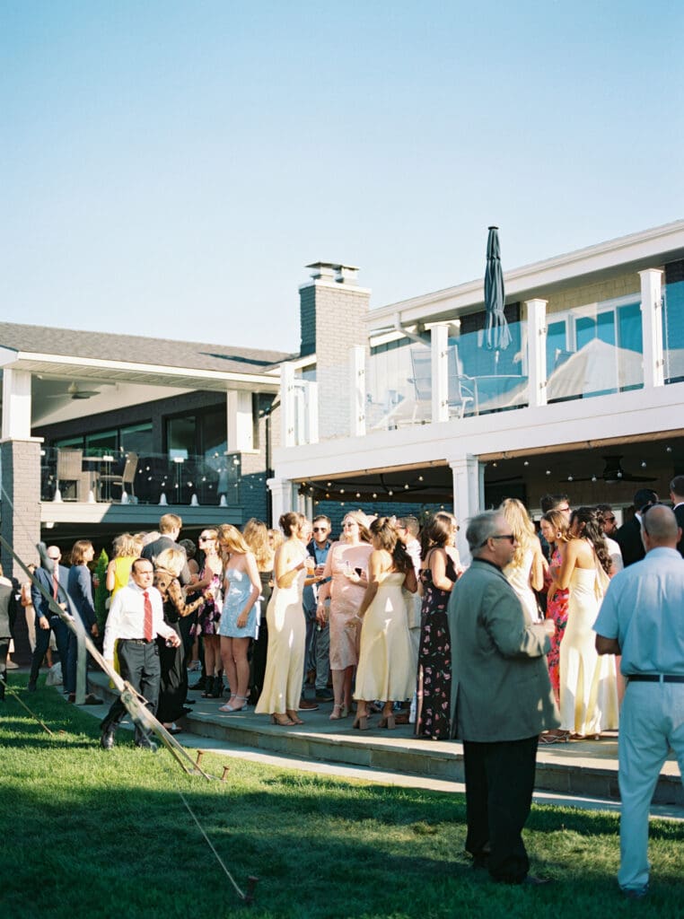Cocktail hour outside a sailcloth tented wedding